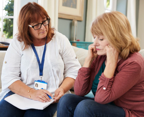 woman making a house call to support a woman during an interview.